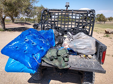 Image of trash in the back of a truck.